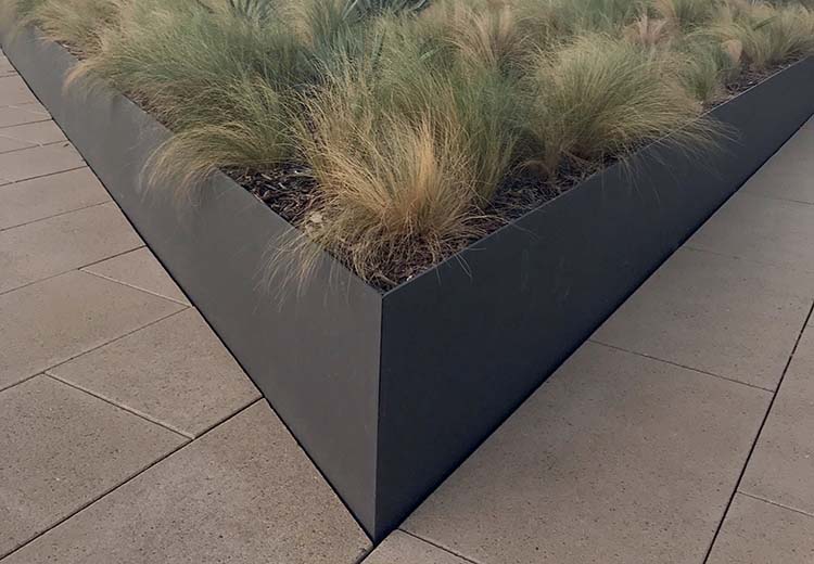 Fused Form and Fiber metal planter box with native California plants inside