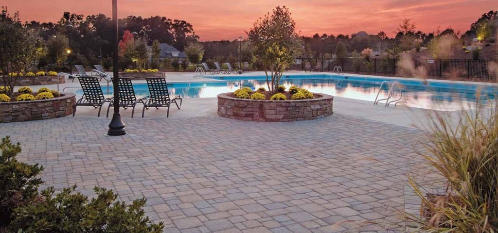 Hanover's Appian Way pavers around a pool at sunset